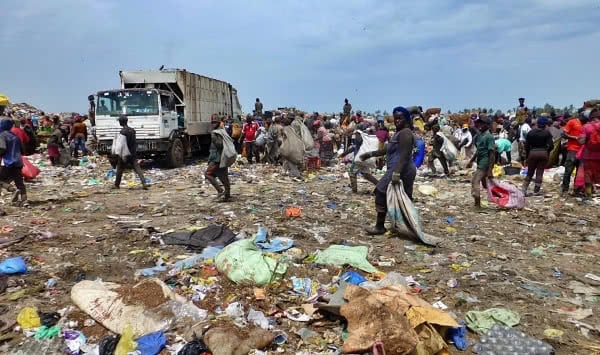 waste pickers clean up beach in Accra, Ghana